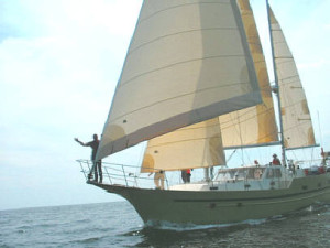 Llyr under sail - on the horizon line with rob and bri