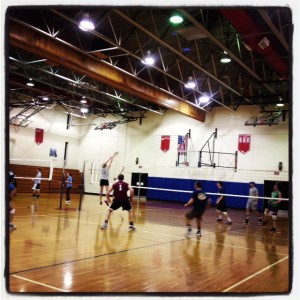 Rob playing indoor volleyball in a gym near his hometown in PA