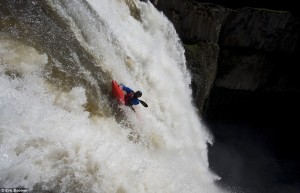 tyler bradt kayaking over waterfall on the horizon line