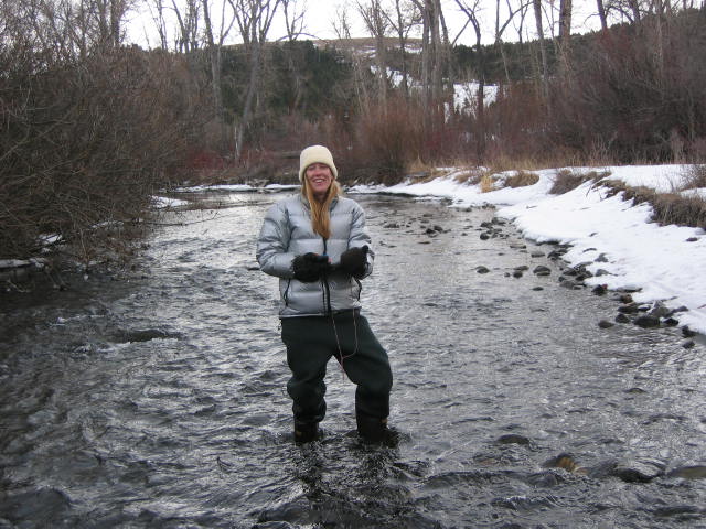 Bri in Little Blackfoot River in Montana - on the horizon line - clark fork coalition