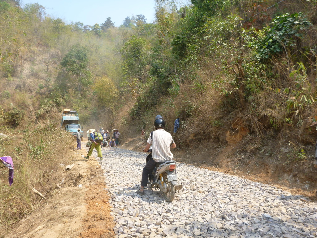 Scooter over construction on Burma roads - Trekking in Myanmar village - Brianna and Rob - On the Horizon Line Travel Blog