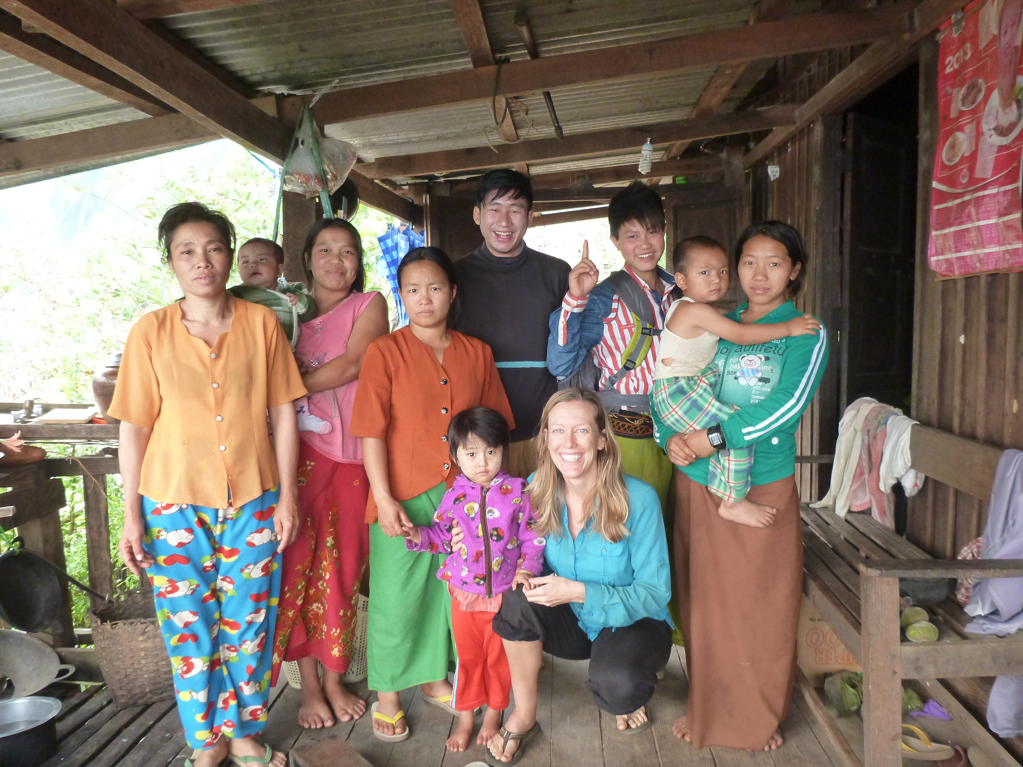 Bri with Shan family in Myanmar village - Brianna and Rob - On the Horizon Line Travel Blog